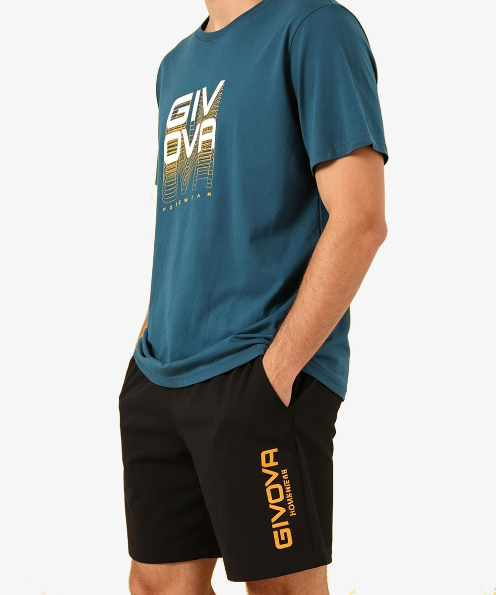 Male model torso wearing teal GIVOVA logo T-shirt and black GIVOVA logo shorts, hands in pockets on plain white background