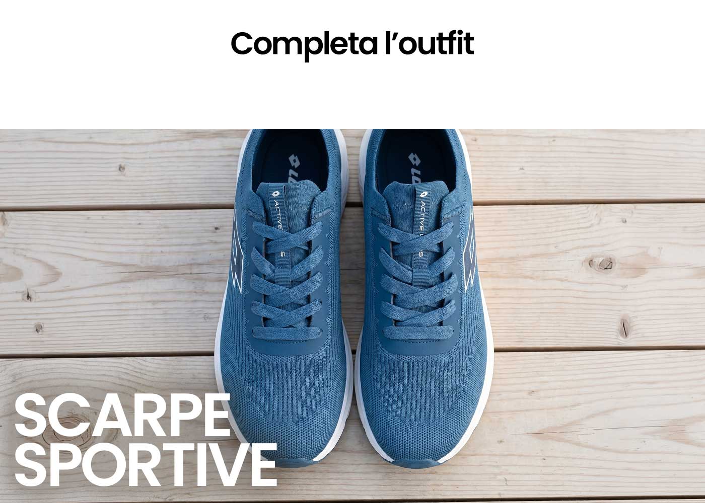 Top-down view of a pair of blue running trainers with knit upper and white soles on wooden floorboards