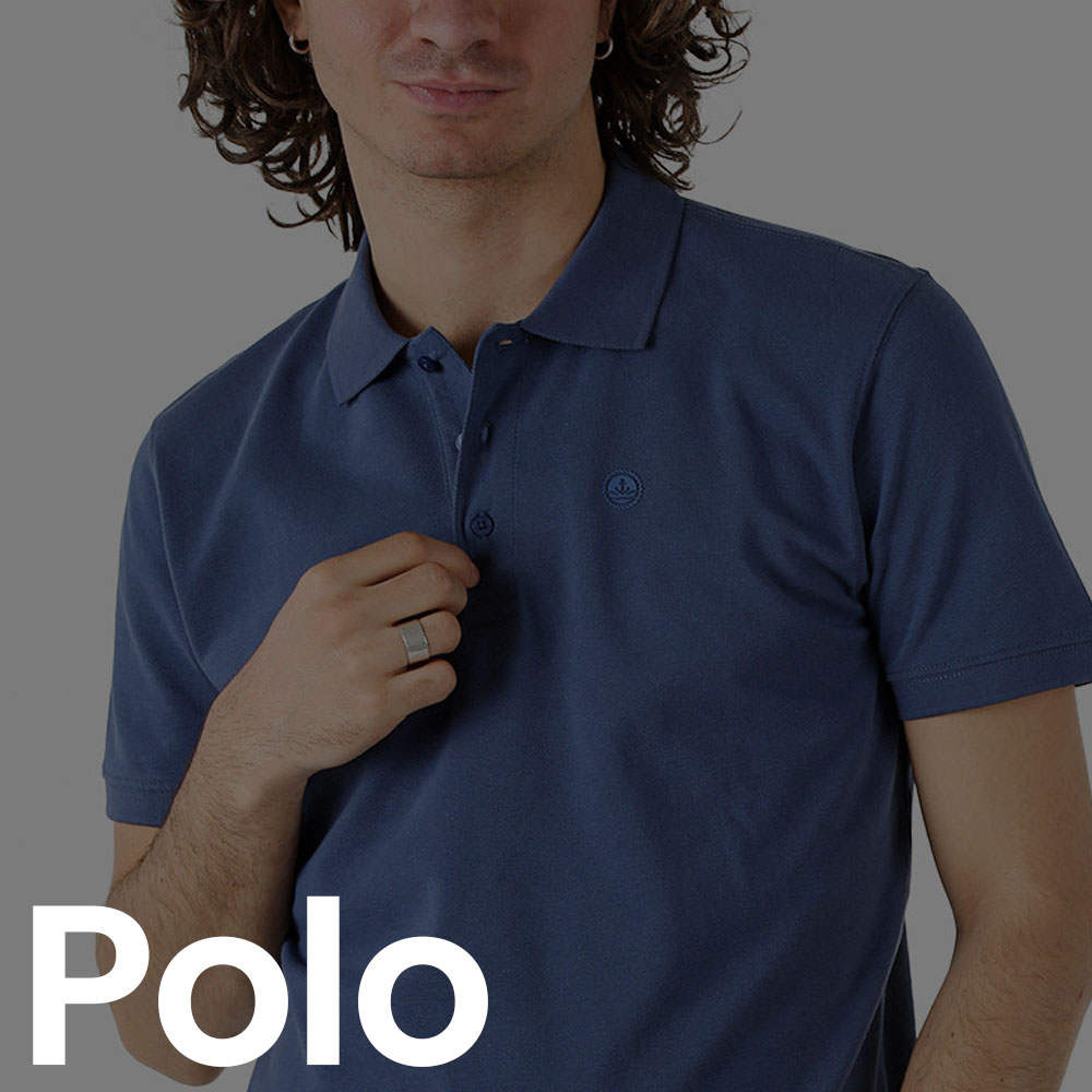Person wearing navy polo shirt with hand near buttons showing a silver ring, cropped torso portrait on a light background