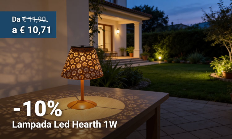 1W LED hearth lamp on outdoor table casting decorative floral shadows on patio at dusk