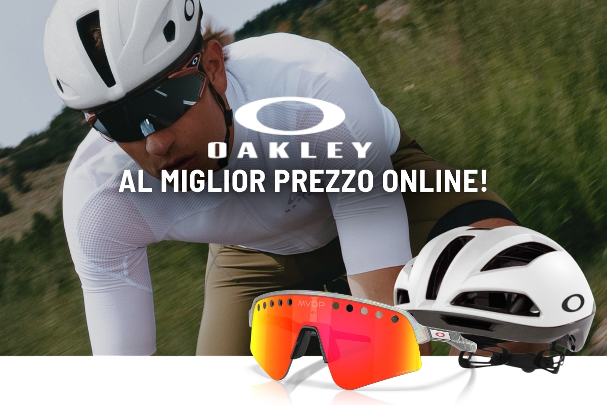 Cyclist wearing white Oakley helmet and sunglasses, with white Oakley helmet and red-orange Oakley sports sunglasses displayed