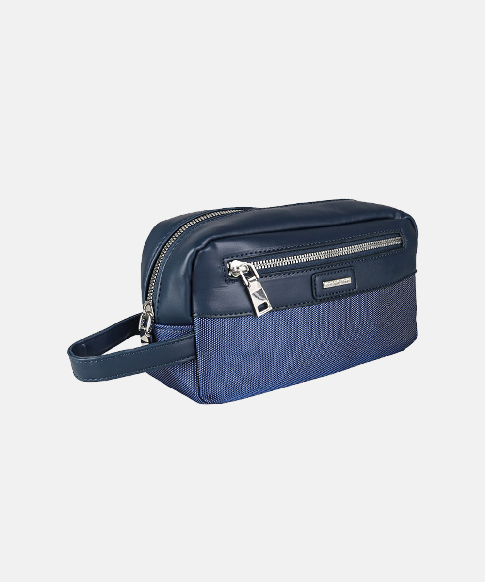 Navy blue men's toiletry bag (dopp kit) with textured fabric base, leather trim, dual zips and wrist strap