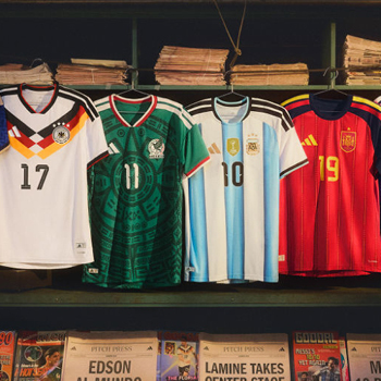 International football shirts (Germany 17, Mexico 11, Argentina 10, Spain 19) hanging above a magazine stand