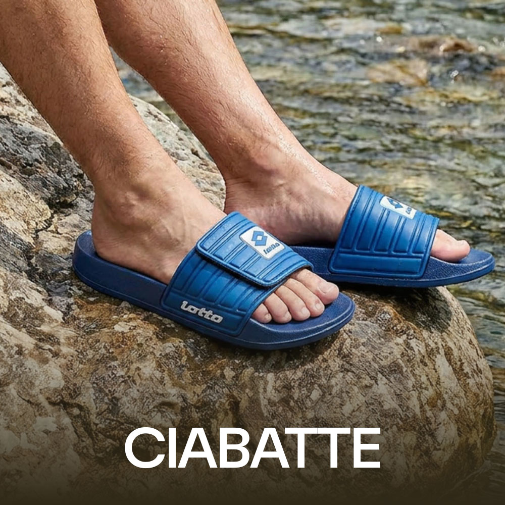 Close-up of feet wearing blue Lotto slide sandals on a rock beside flowing water
