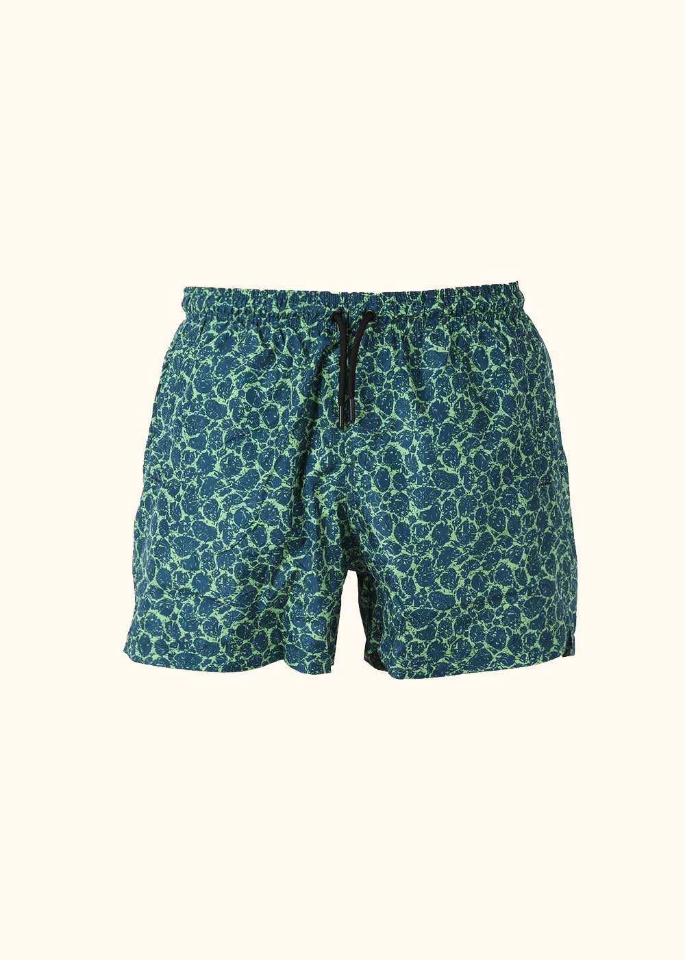 Men's navy and lime-green floral swim shorts with elastic waistband and black drawstring on cream background