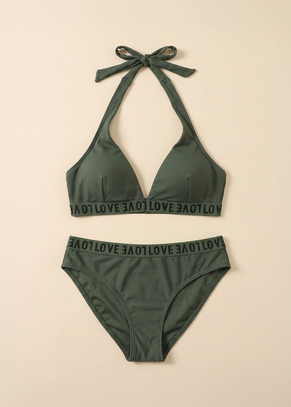 Green halter-neck bikini set with 'LOVE' elastic band detailing, padded triangle top and high-waist briefs, flat lay