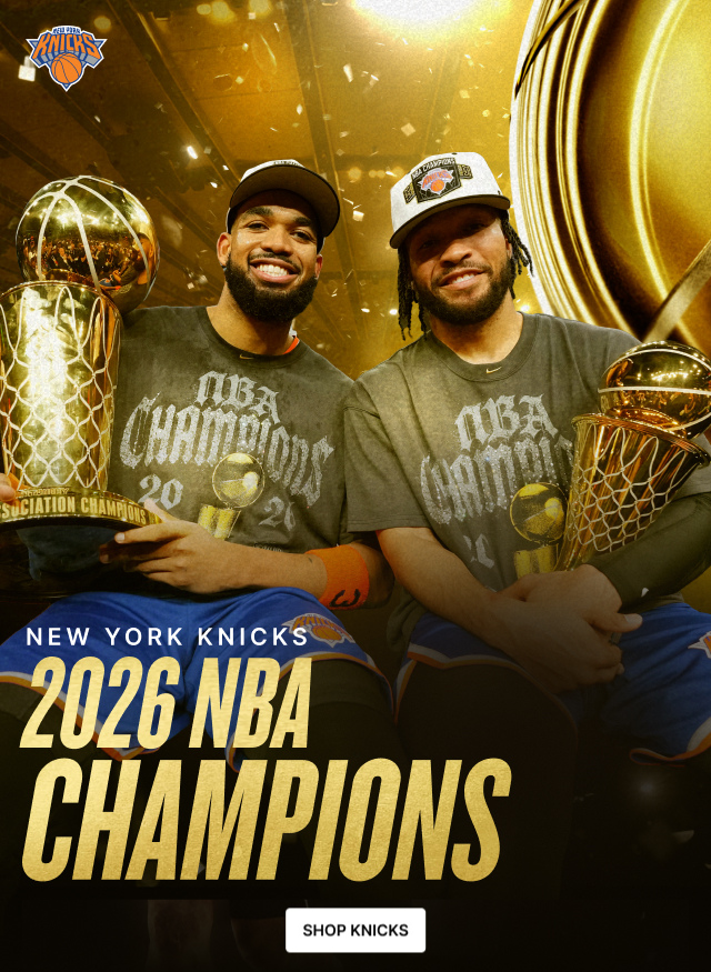 Karl-Anthony Towns and Jalen Brunson holding the champs trophy