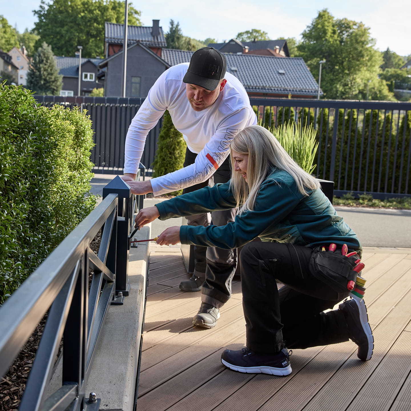 Woman and man wearing Helly Hansen Workwear 