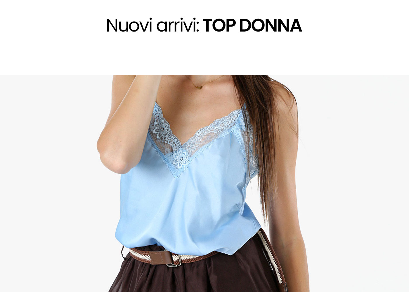 Cropped photo of a woman wearing a light blue lace-trim camisole tucked into a brown skirt with braided belt under 'New arrivals: women's tops' heading