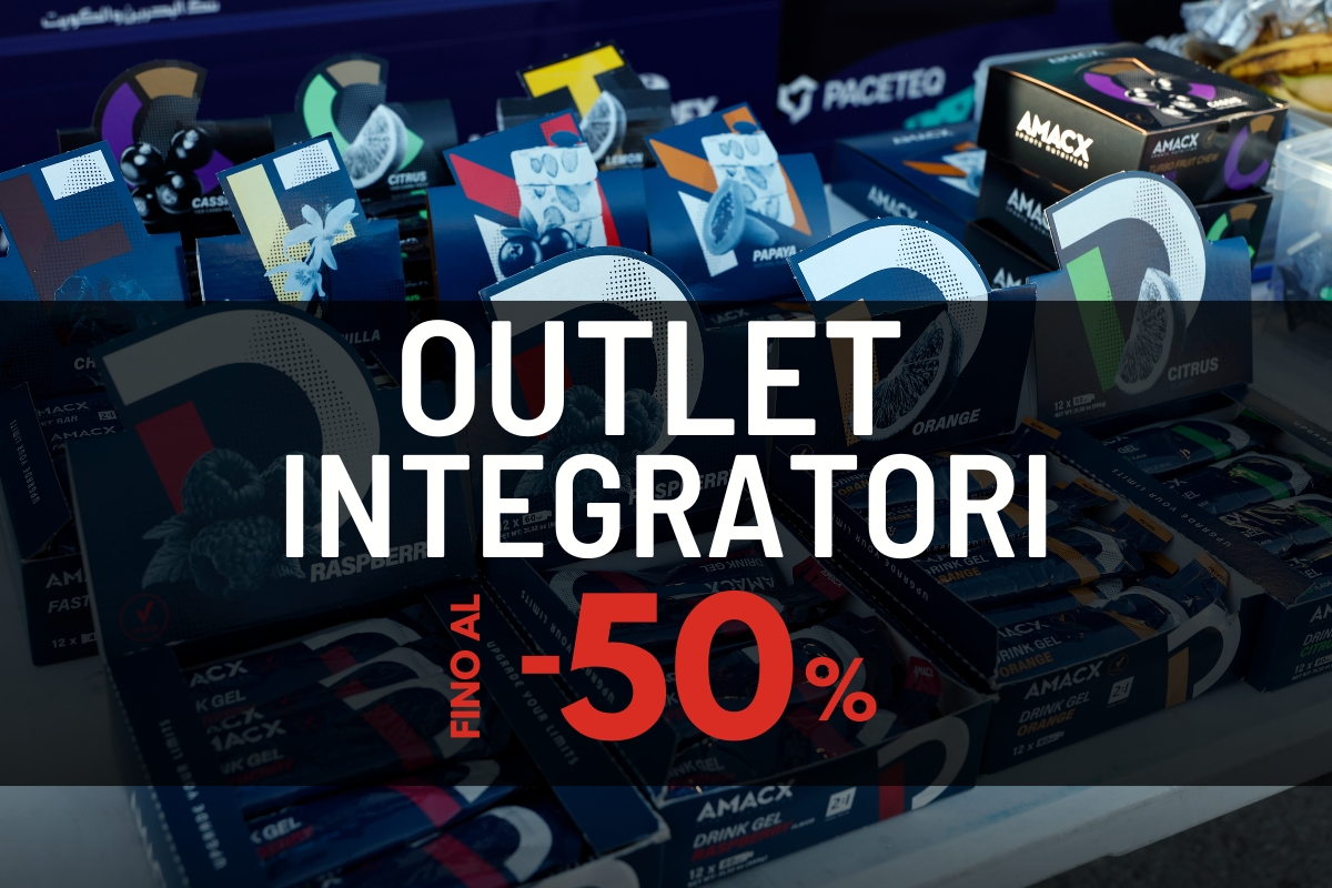 Outlet integratori sale sign over stacked AMACX supplement and drink gel boxes showing up to 50% off