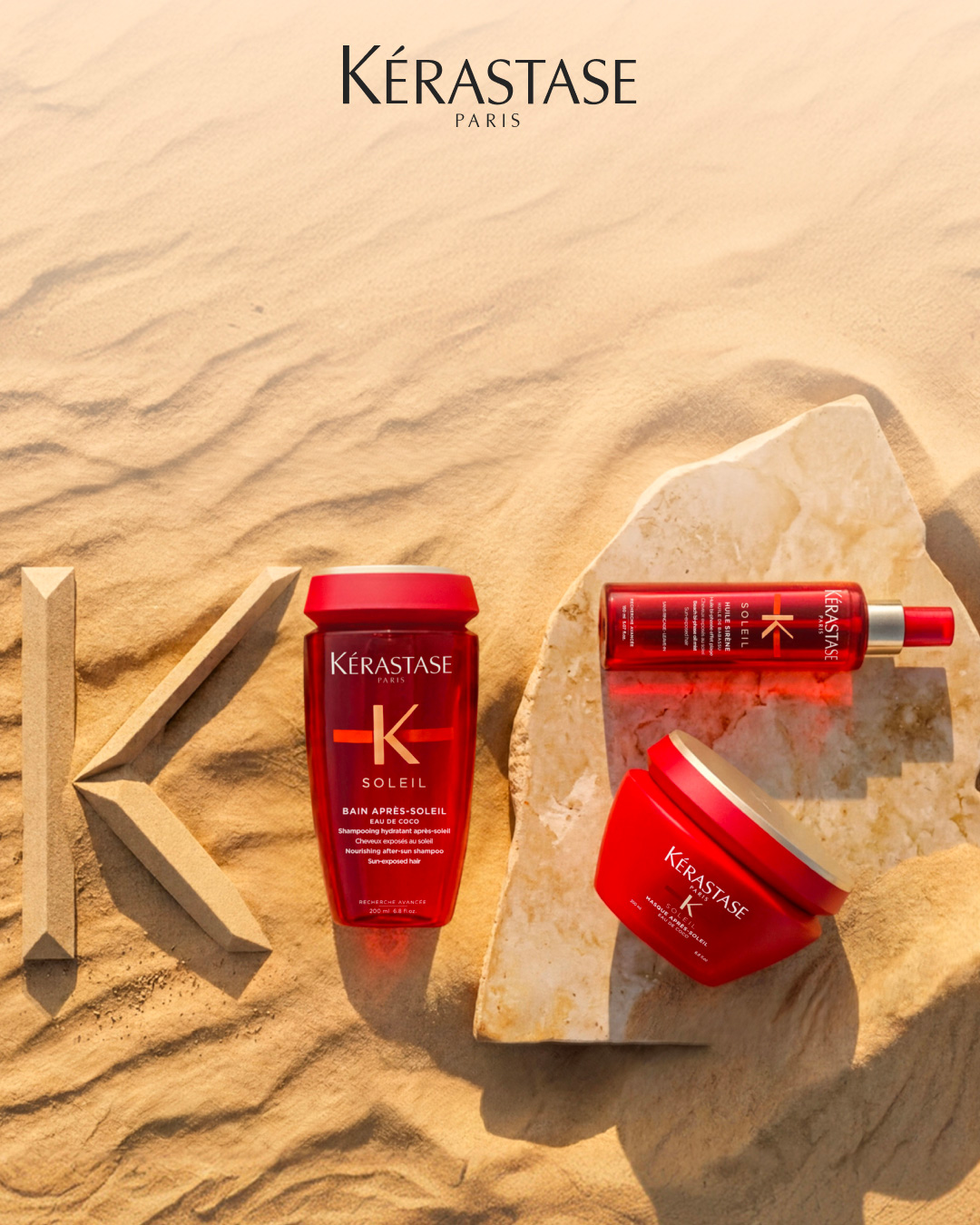 Bain Apr&egrave;s-Soleil, Masque Apr&egrave;s-Soleil e Huile Sir&egrave;ne esposti su una spiaggia assolata.