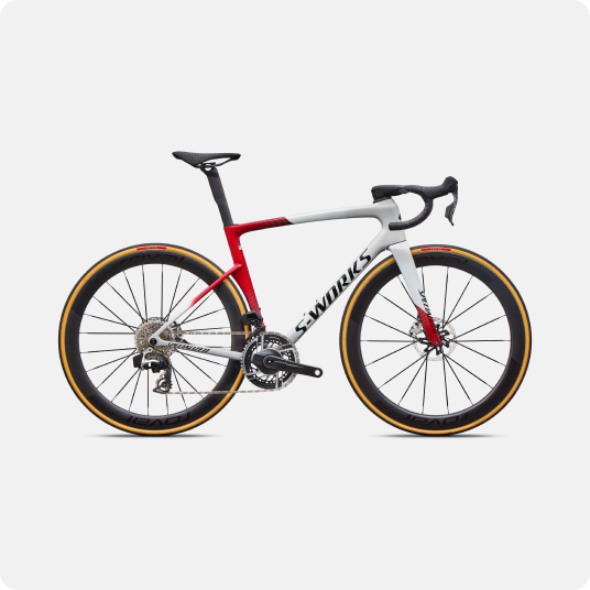 S-Works red and white carbon road racing bicycle with aero deep-section wheels, disc brakes and integrated cockpit on white background
