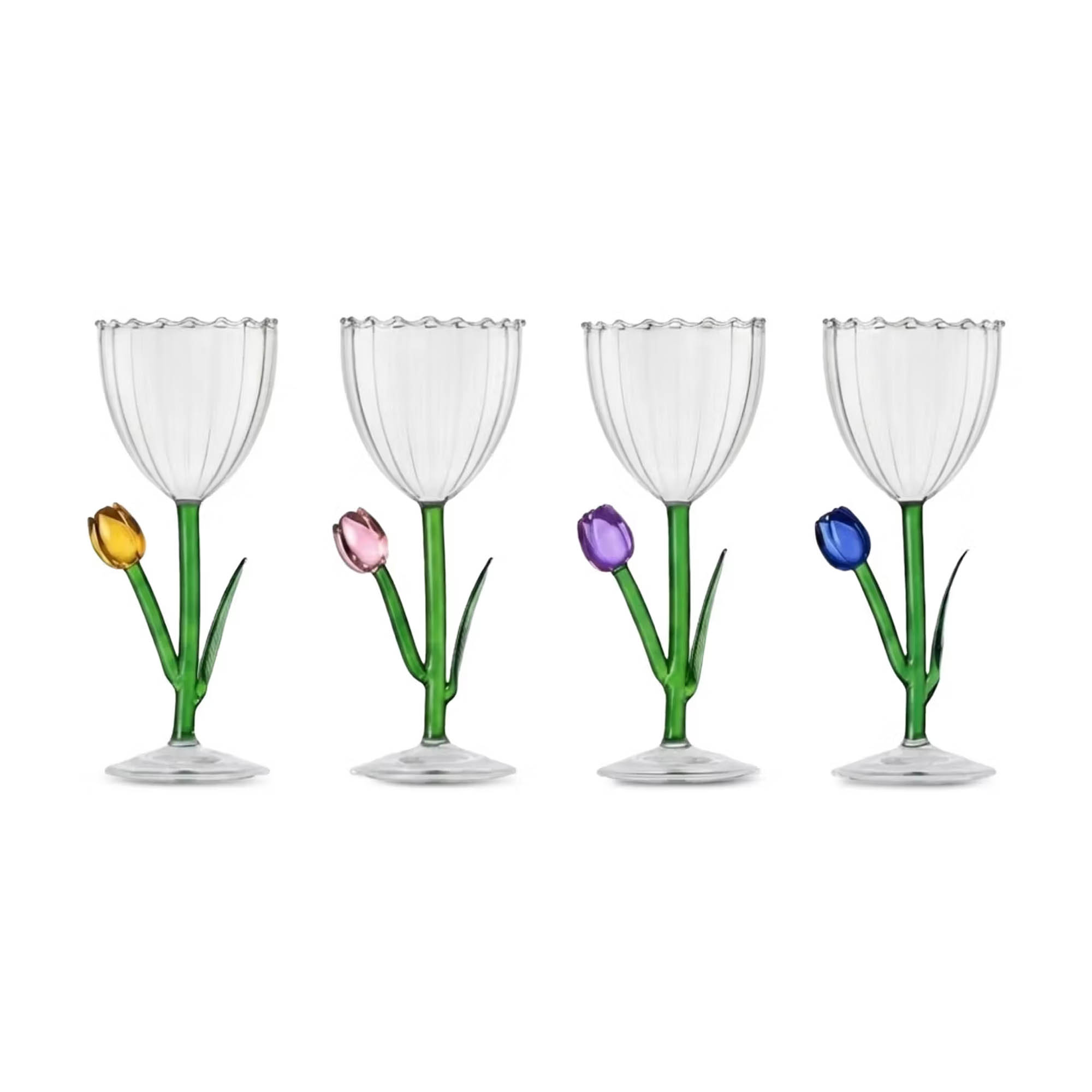 Four clear glass wine goblets with green tulip-shaped stems and coloured tulip bud accents in yellow, pink, purple and blue