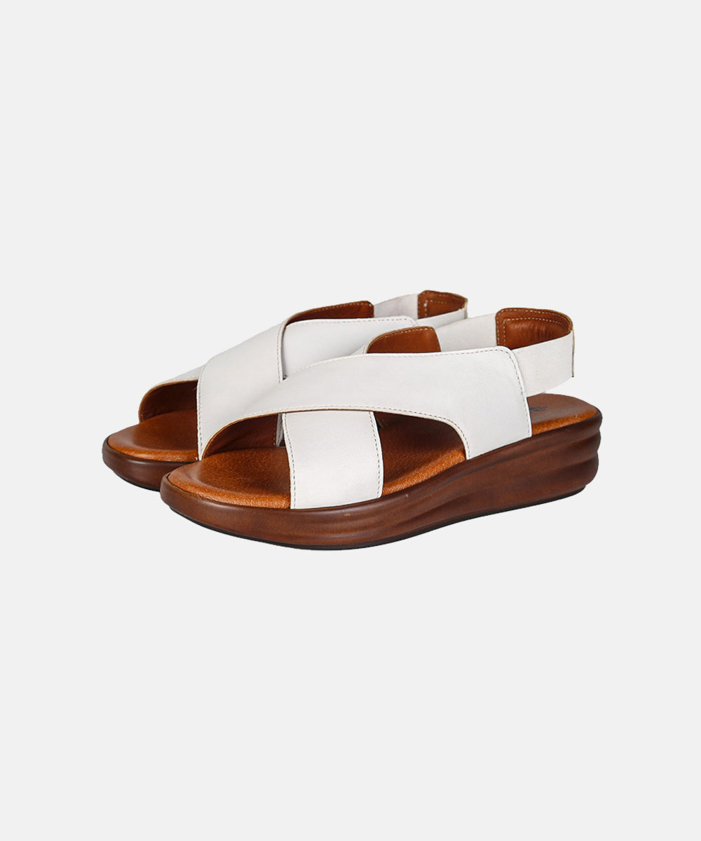 Women's white leather criss-cross slingback sandals with tan cushioned footbed and brown wedge sole, comfortable footwear
