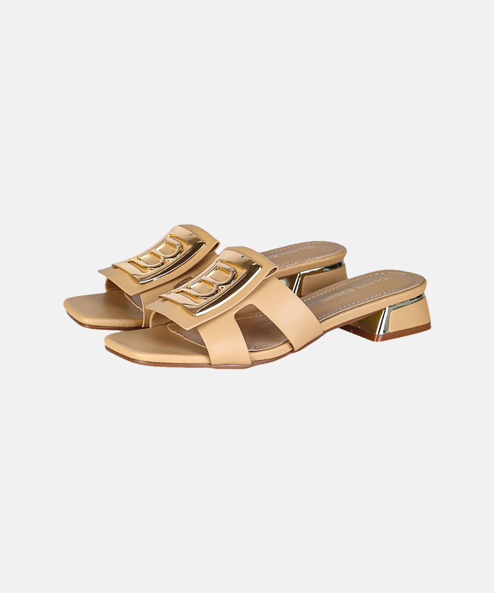 Pair of women's nude beige leather slide sandals with low block metallic heels and gold chain embellishment