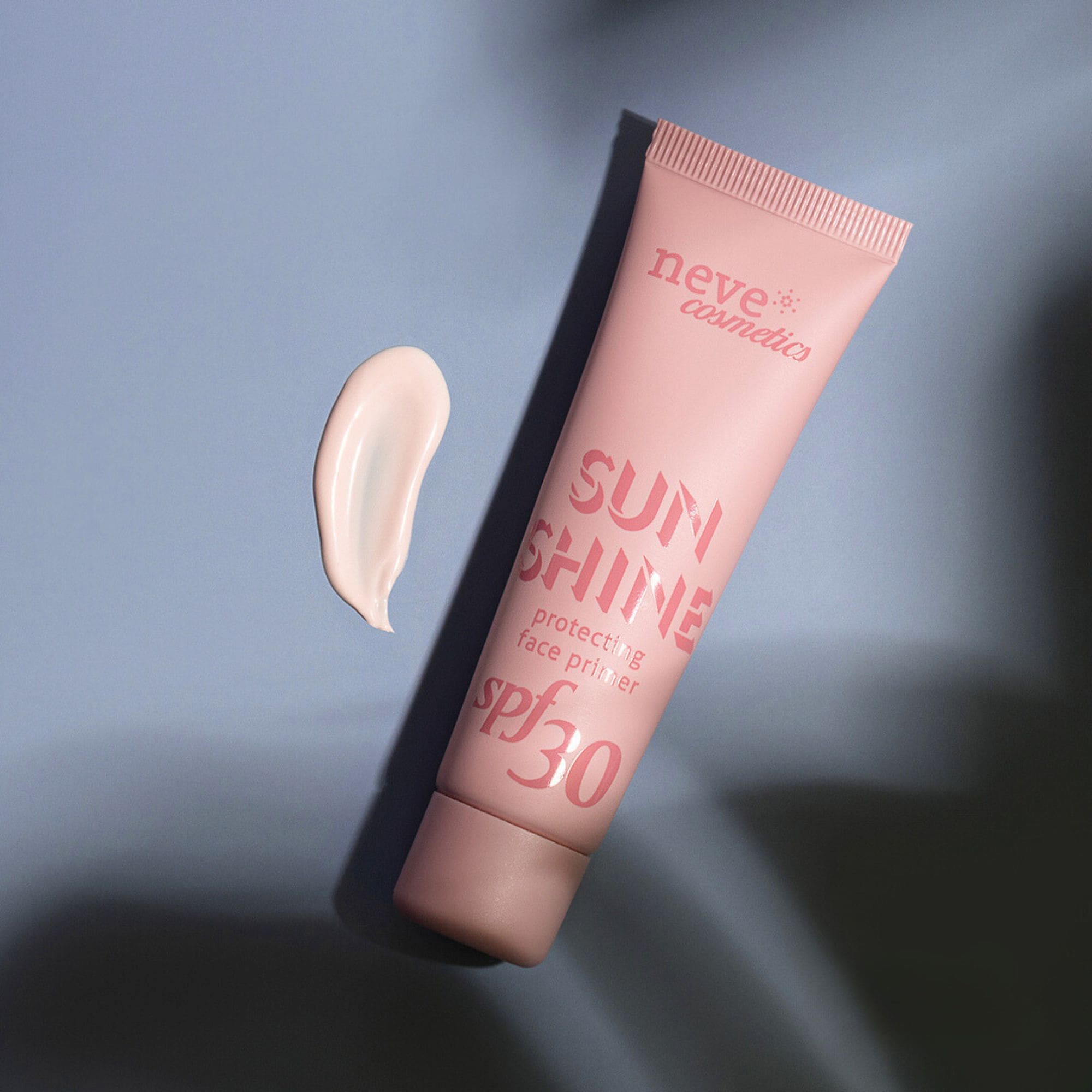 Pink tube of Neve Cosmetics 'Sunshine' SPF30 protecting face primer with a cream swatch on a pale blue background