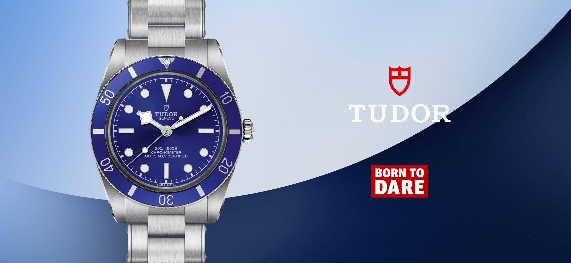 Tudor Black Bay dive watch with blue dial and bezel on stainless steel bracelet, Tudor logo and "Born to Dare" slogan