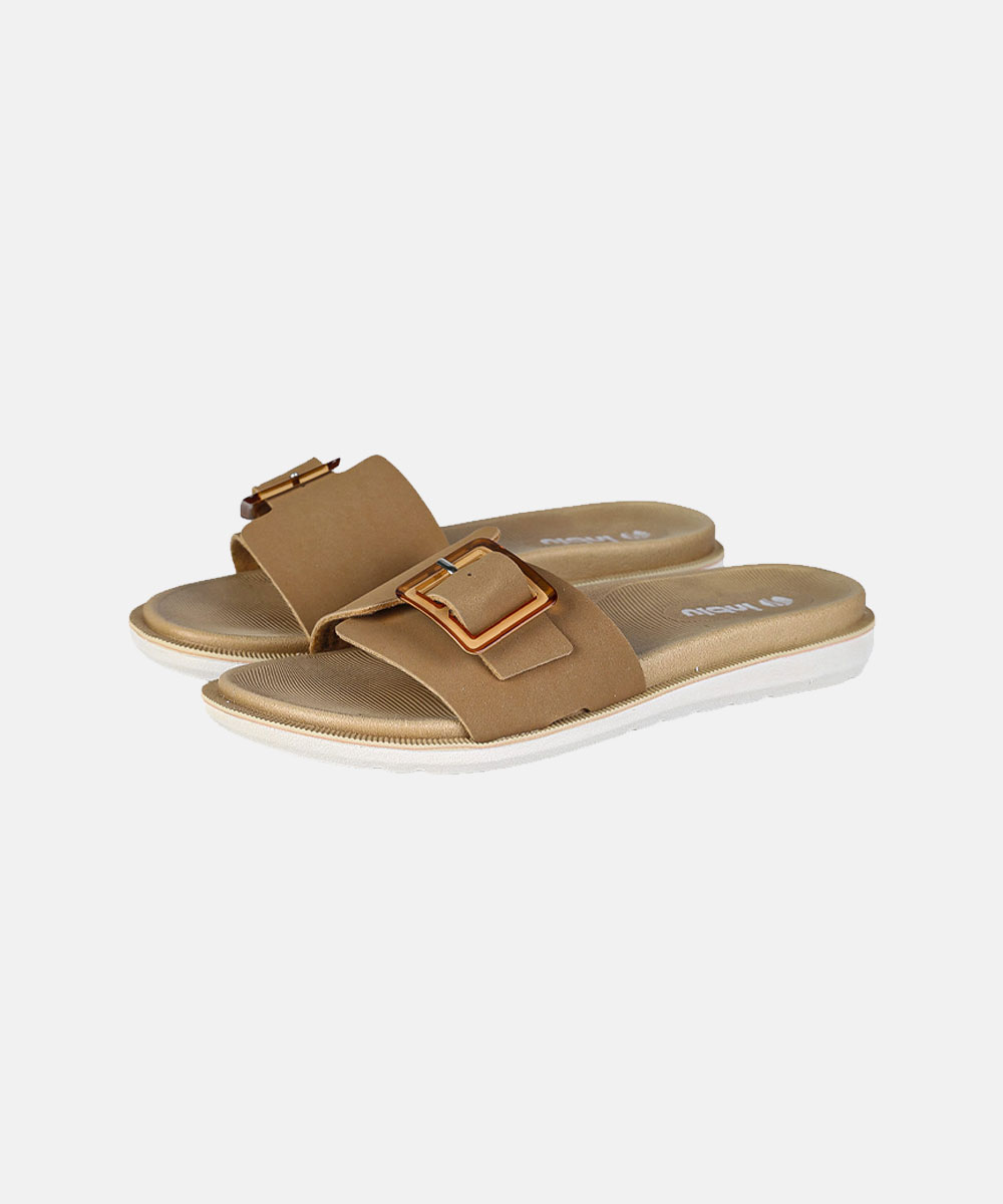 Pair of tan slide sandals with gold buckles and cushioned textured footbeds on white soles, studio product photo