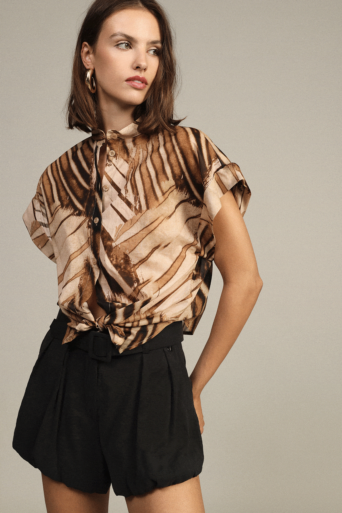 Collage: patterned blouse with black shorts; backless black midi dress and heels; close-up of striped one-shoulder top