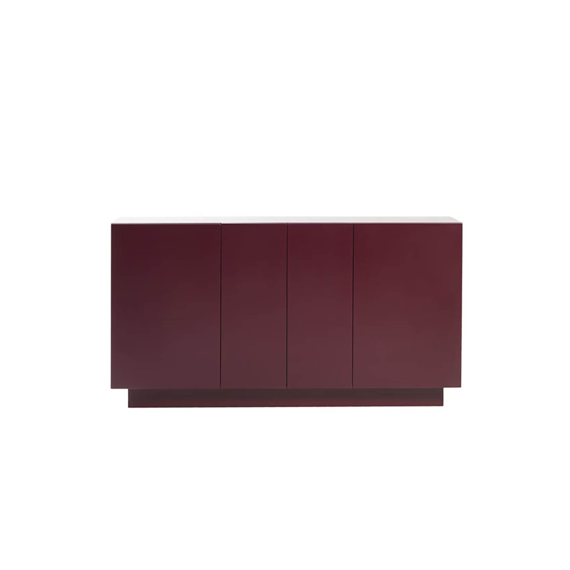 Burgundy modern sideboard with four vertical doors on a recessed plinth base, isolated on a white background