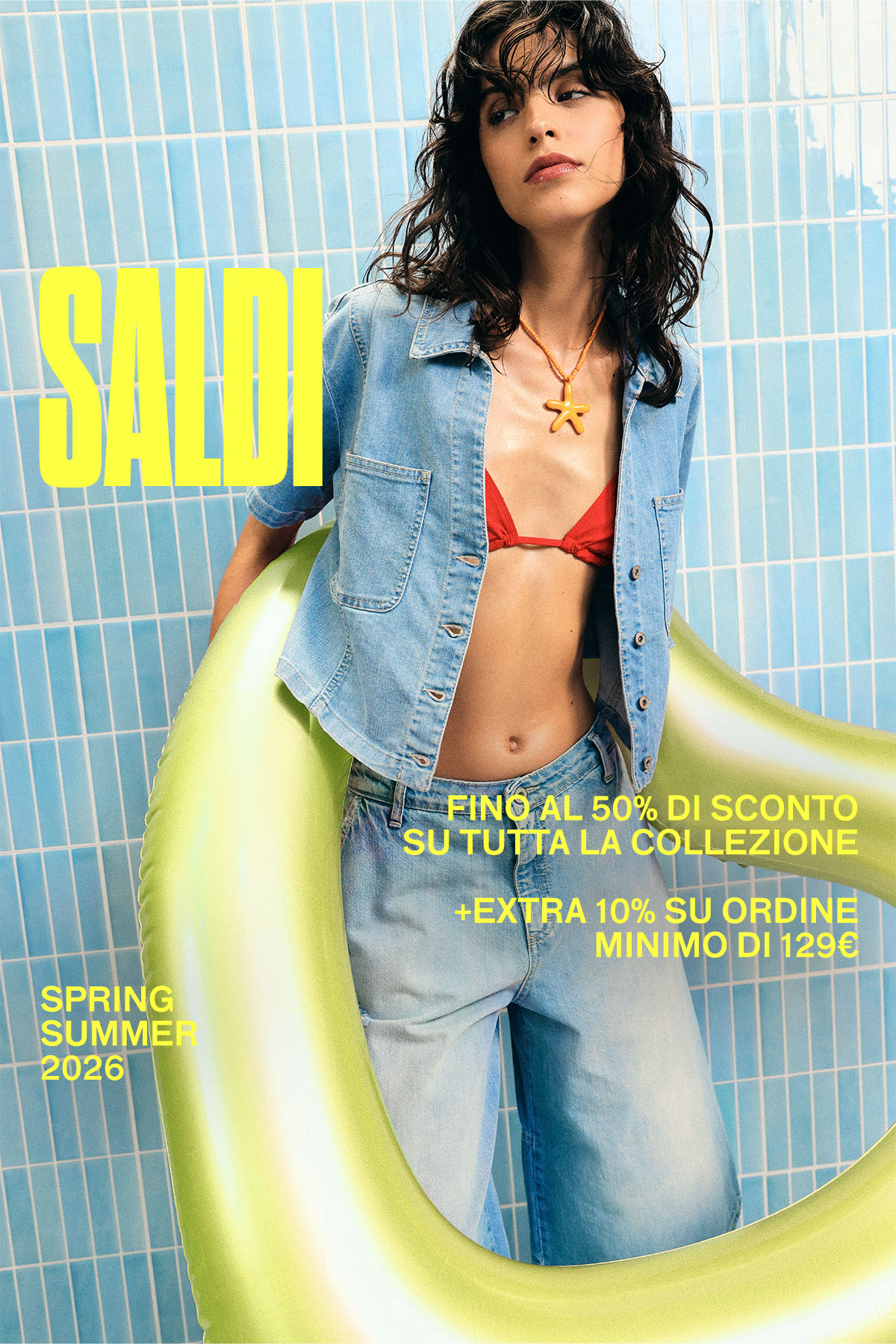 Model in denim jacket, red bikini top and jeans holding yellow inflatable ring against blue tiled wall with 'SALE' text overlay