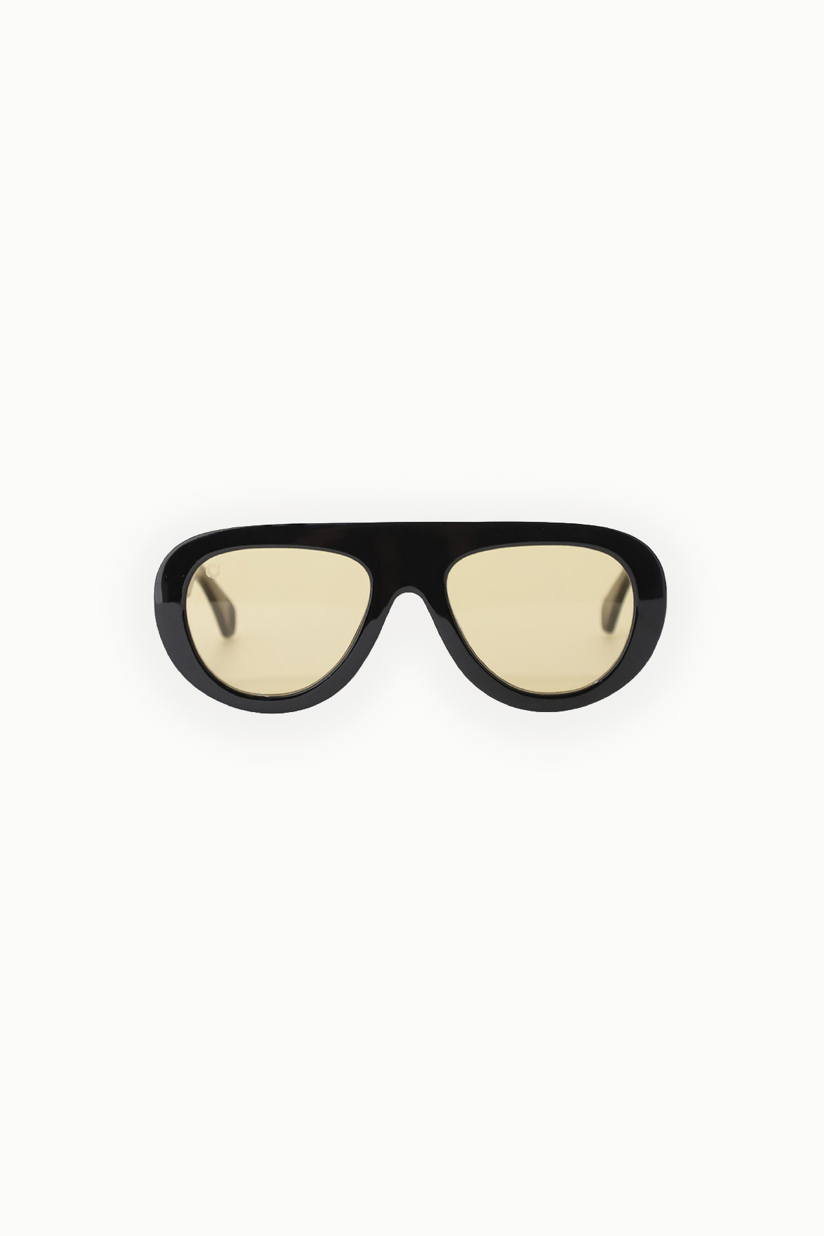 Black wraparound sunglasses with yellow-tinted lenses on white background, retro aviator-style