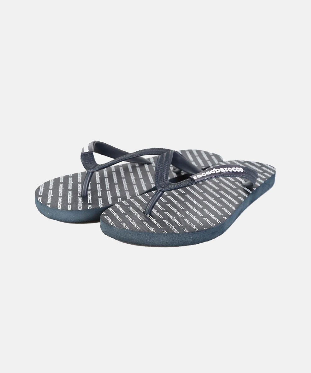Pair of navy rubber flip-flops with repeating white logo print and textured thong straps on white background