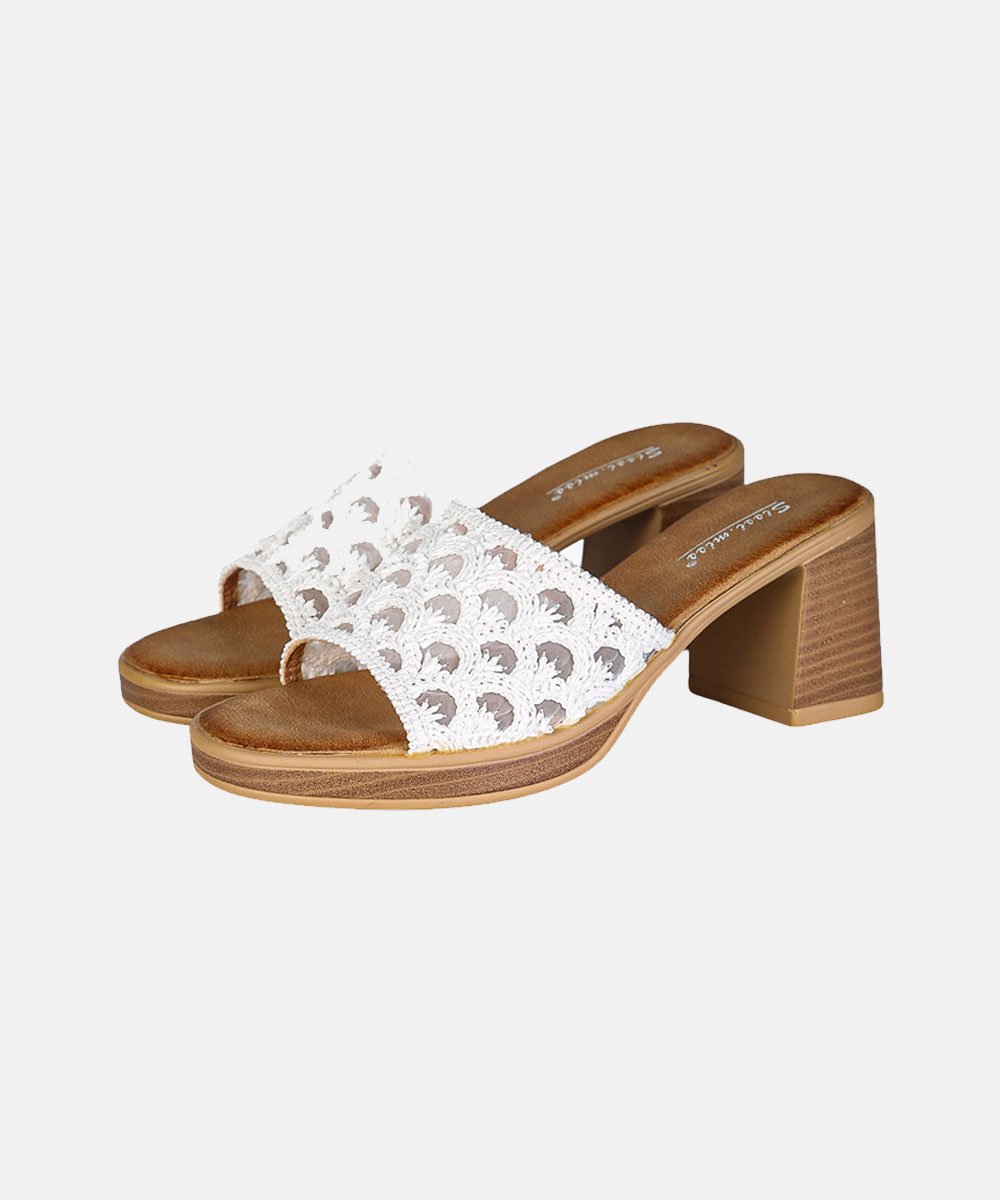 Pair of white crochet open-toe slide sandals with tan cushioned footbed and stacked block heel