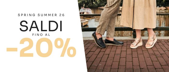 Spring/Summer sale banner showing two people wearing loafers and wedge sandals by a canal, text “SALDI -20%”
