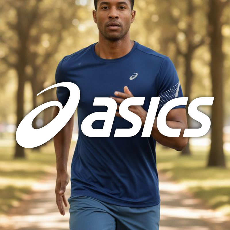Man jogging in park wearing blue ASICS running top and shorts with prominent ASICS logo overlay