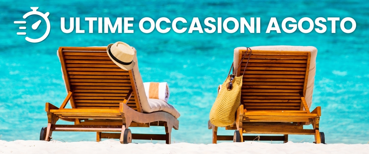 Two wooden beach loungers with hat and straw bag on white sand facing turquoise sea, banner reading 'Last-minute August offers'