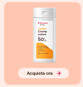 “Flacone Redcare Derma Junior Crema Solare SPF 50+ su sfondo rosa con pulsante ‘Acquista ora’.” “Flacone Redcare Derma Junior Crema Solare SPF 50+ su sfondo rosa con pulsante ‘Acquista ora’.”