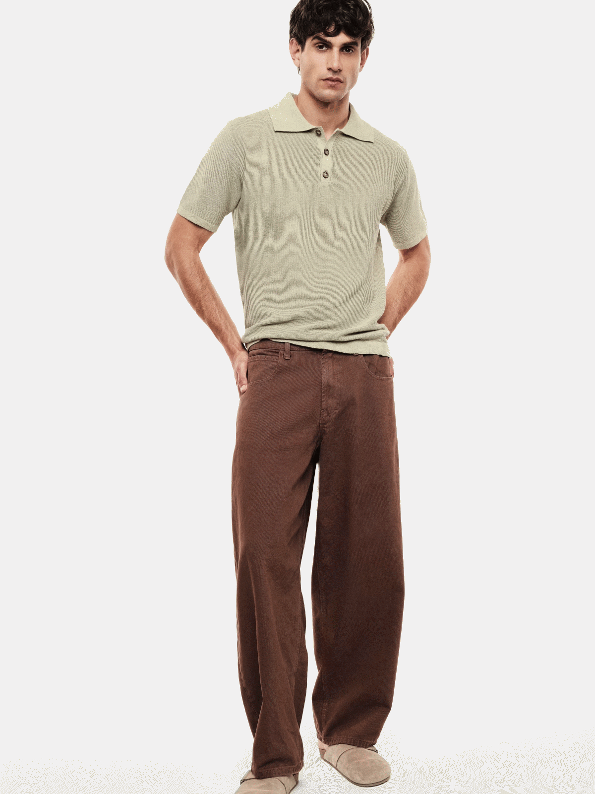 Male model in a 3x3 grid wearing a light green polo and brown wide-leg corduroy trousers, front, back and close-up views