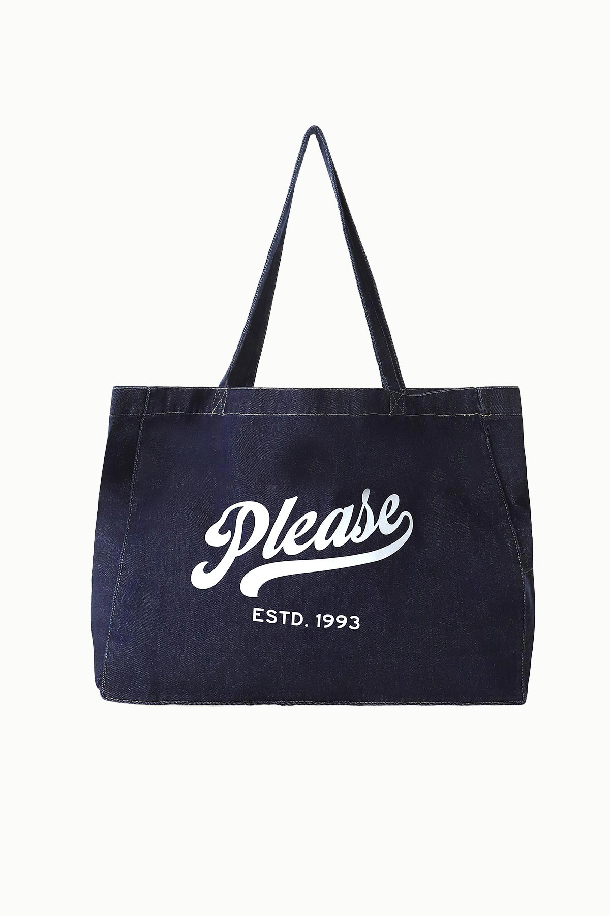 Navy canvas tote bag with white 'Please' script logo and 'ESTD. 1993' text, long shoulder straps