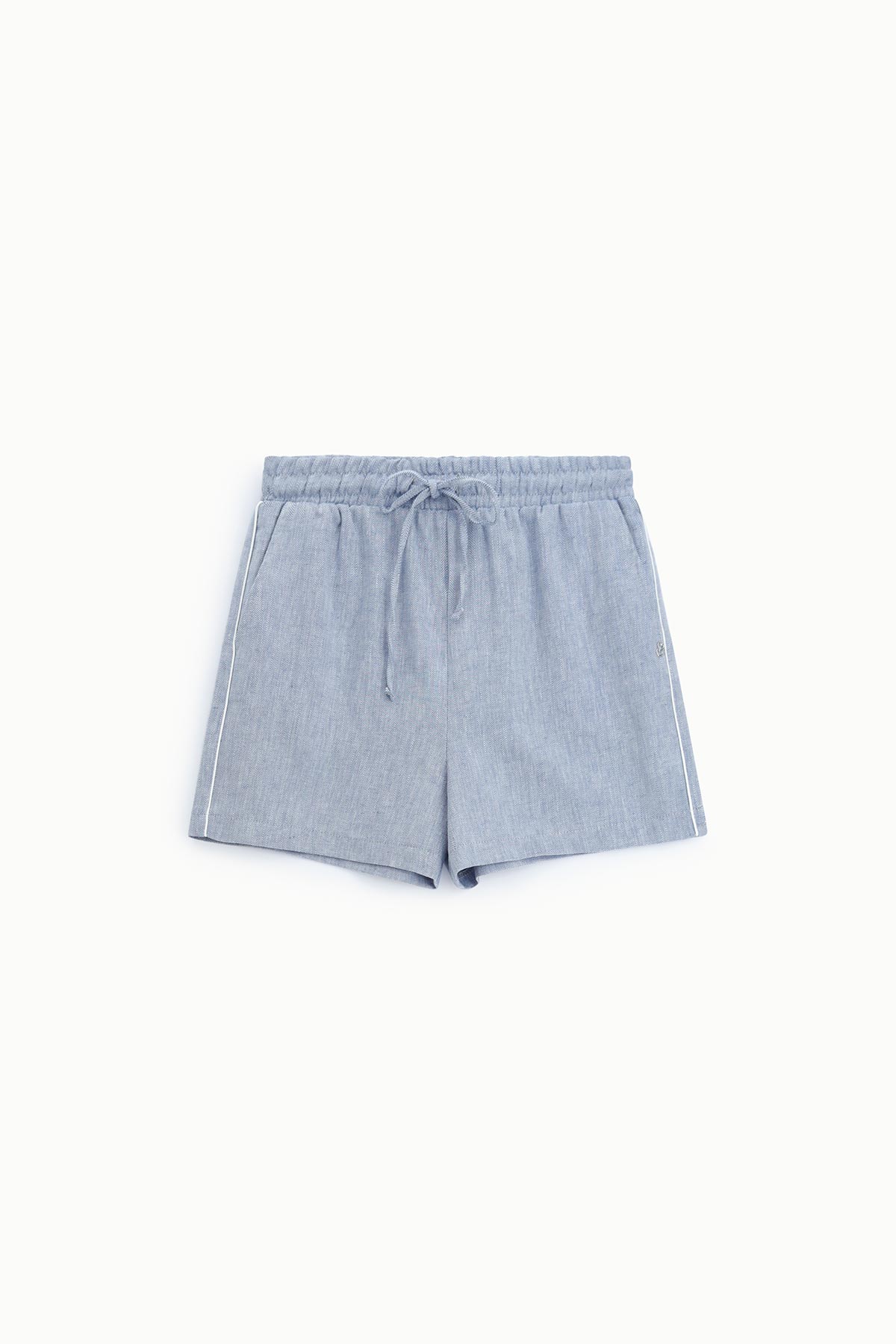Light blue chambray drawstring shorts with elastic waist and white side piping, flat lay on white background