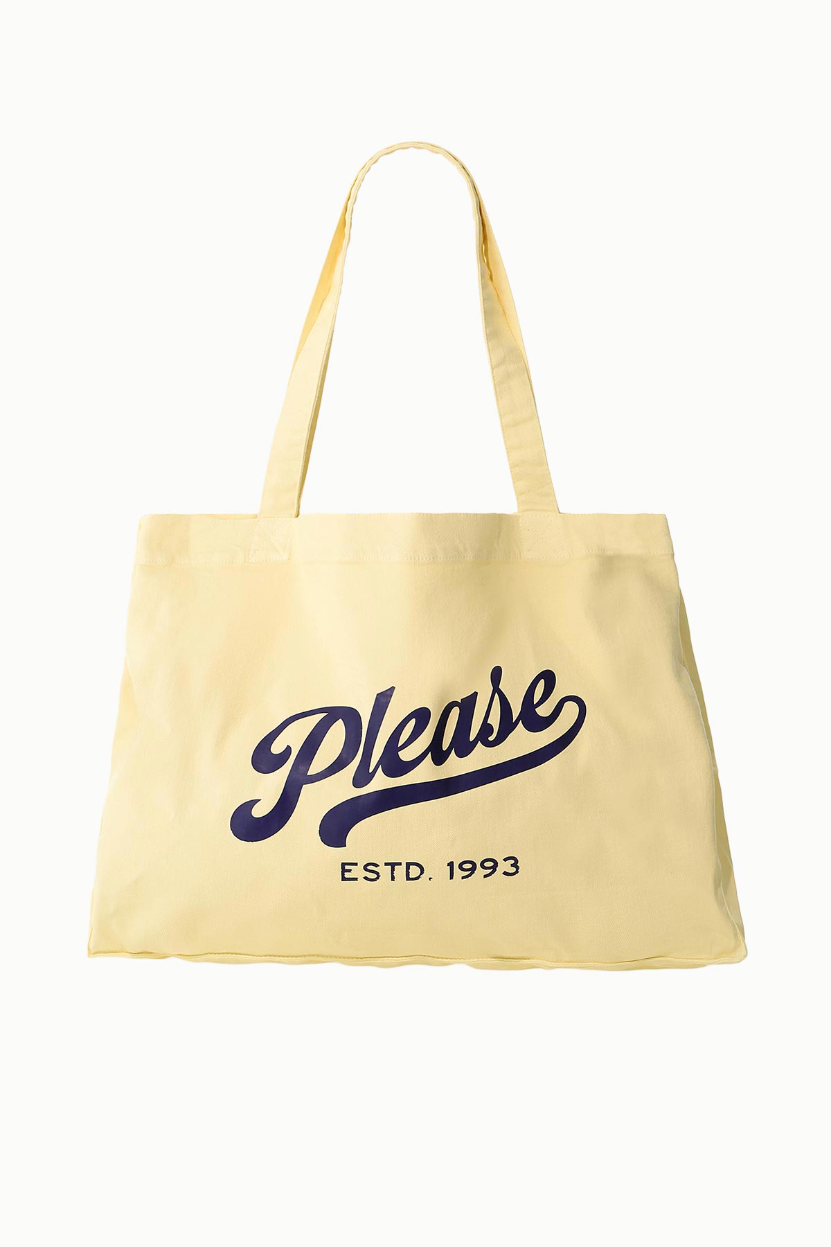 Yellow canvas tote bag with long handles, navy script reading "Please" and small text "ESTD. 1993" printed on the front