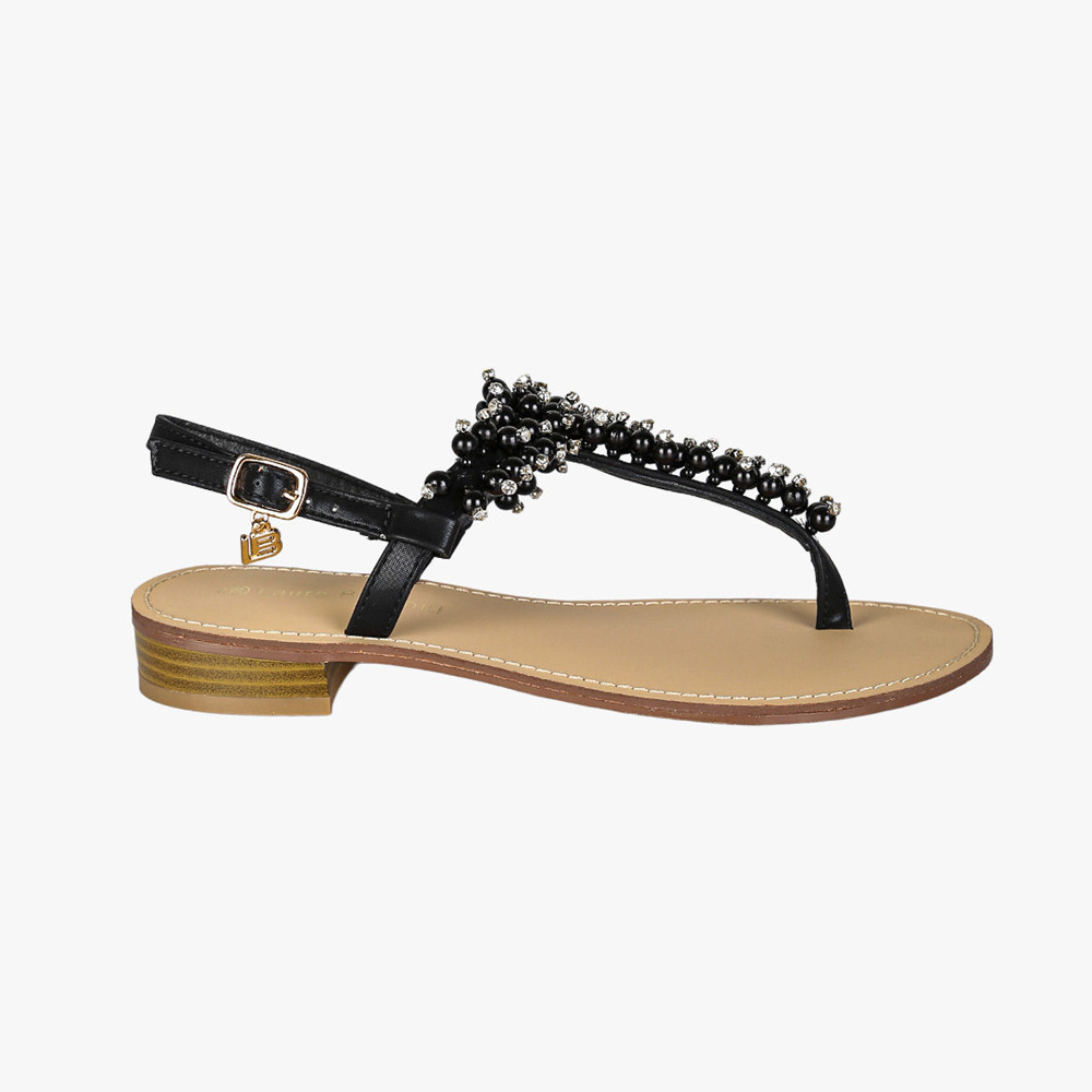 Black women's beaded thong sandal with ankle strap, gold charm and tan insole on low stacked heel