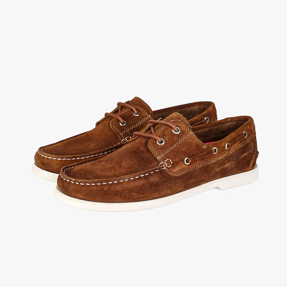 Pair of brown suede boat shoes with white rubber soles, leather laces and contrast stitching – casual men's deck shoes