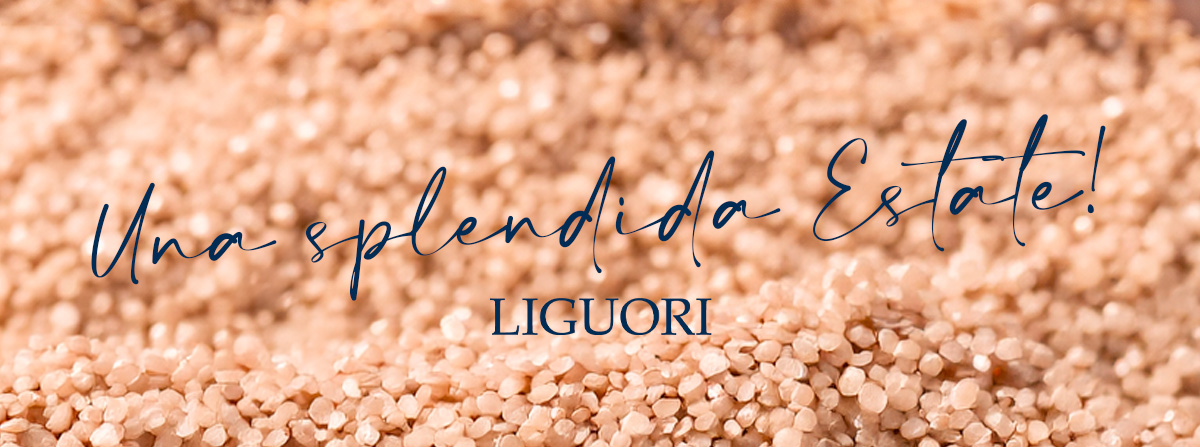 Close-up of peach-coloured grains background with Italian script text 'Una splendida Estate!' and brand name 'LIGUORI'