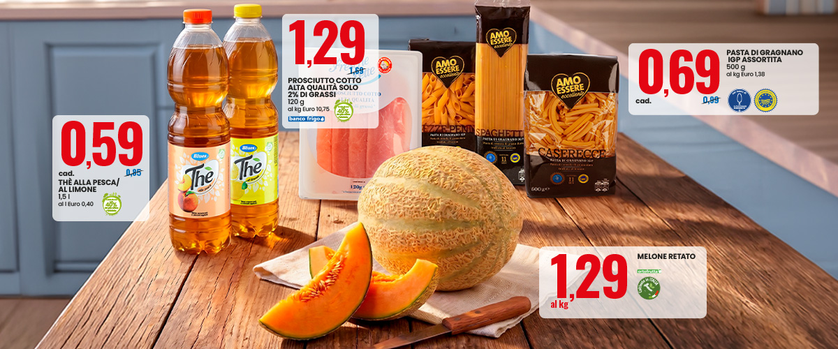 Grocery display on wooden table: sliced cantaloupe melon, bottled iced tea, packed pasta and prosciutto with prominent euro price tags