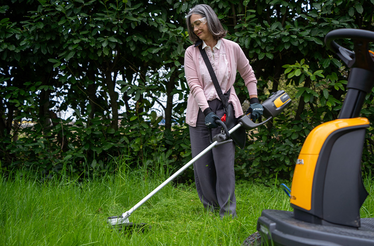 STIGA woman using a brushcutter