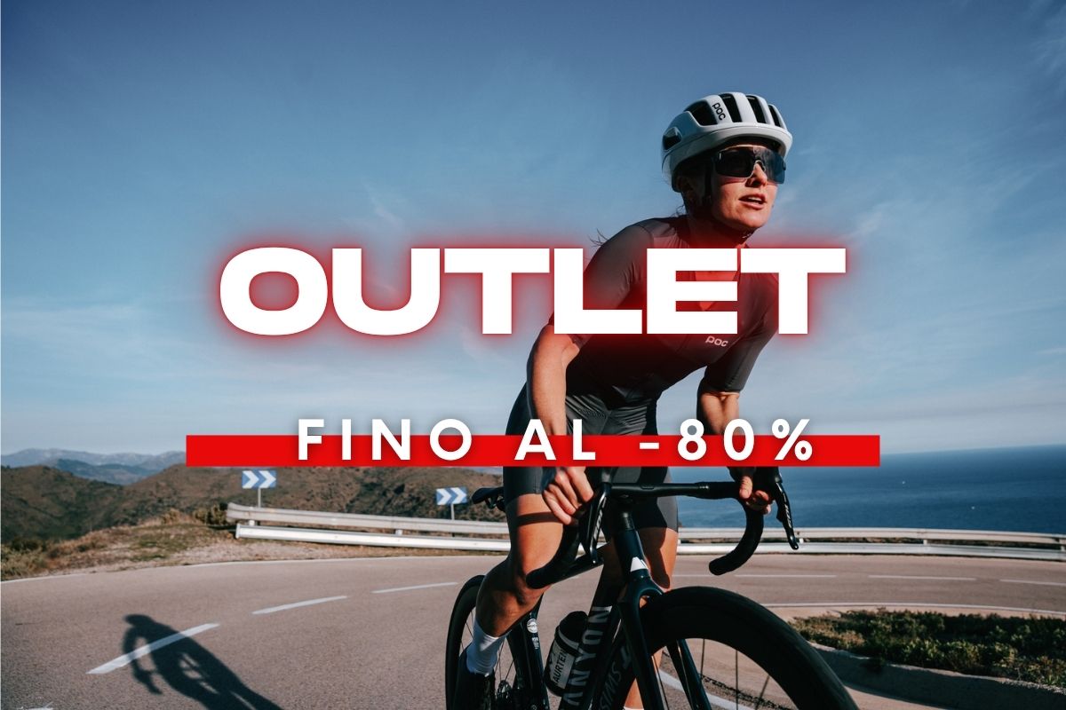 Cyclist in helmet riding a coastal road beside the sea with bold 'OUTLET' and 'up to 80% off' red sale overlay