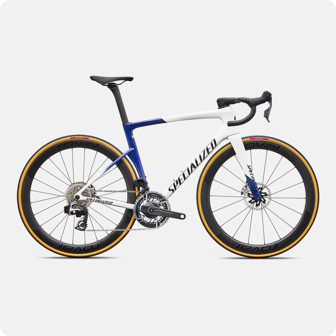 White and blue Specialized carbon road bike with deep-section Roval wheels, tan-wall tyres, disc brakes and aero frame