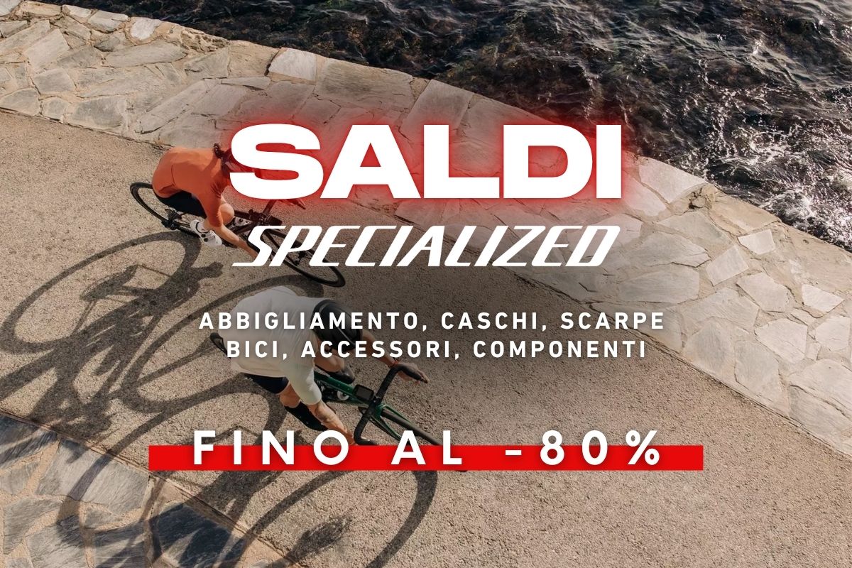 Overhead view of two cyclists on a seaside path with a 'Specialized' sale banner advertising up to 80% off bikes, clothing and accessories