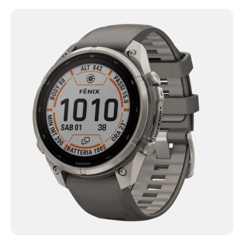 Garmin Fenix multisport GPS smartwatch with silver bezel and grey silicone strap, digital display showing 1010 and battery icon