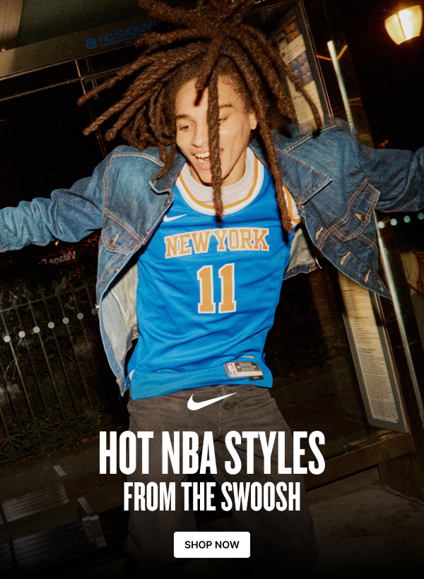 Model wearing a blue New York Nike jersey and denim jacket. Shop hot NBA styles from the Swoosh.