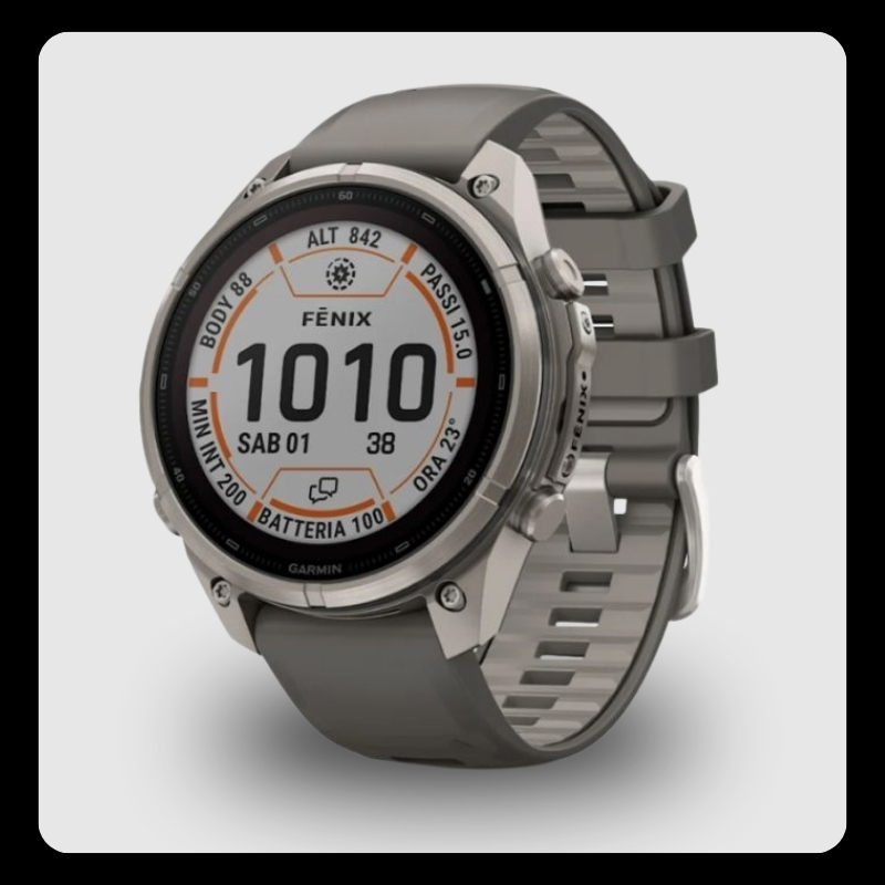 Garmin Fēnix multisport GPS smartwatch with round titanium case and grey silicone strap displaying digital activity screen