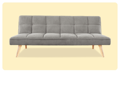 Grey fabric three-seater futon sofa bed with tufted grid back and tapered wooden legs on pale background