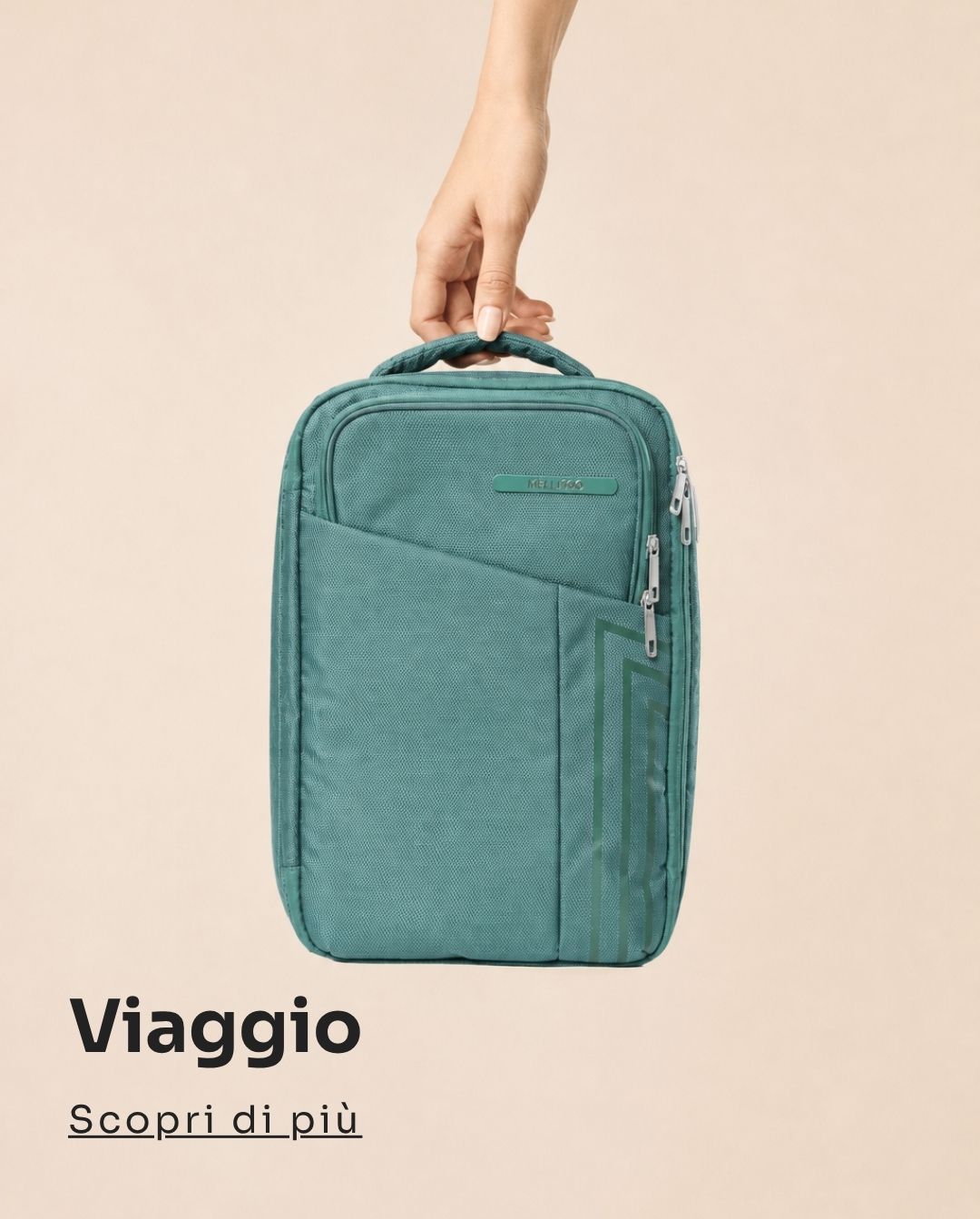 Teal compact travel backpack held by a hand against a beige background, front zip pockets and top carry handle