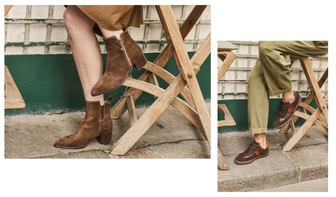 Two side-by-side images of people seated on wooden chairs: brown suede zip ankle boots with block heel and brown leather sneakers with olive pants